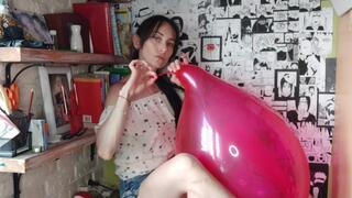 I gently play with the red balloon using my mouth - Mishel Looner Balloons