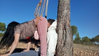 Farting in his face while I crush it between my ass and the tree