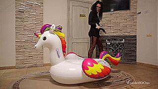 Strict boss popping inflatable unicorn