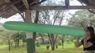 Katie Blows to Pop Two Q260 Balloons