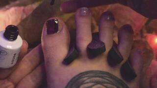 Painting my toenails dark red & caressing my tattooed feet
