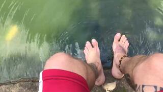 washing sweaty feet in the lake