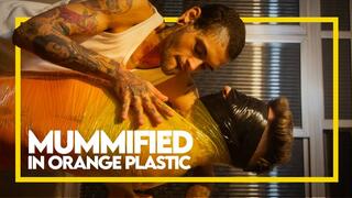 Mummified in Orange Plastic (1080p) Gay Bondage - Gay Domination - Mummification - Foot Fetish - BDSM