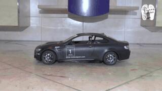 Black RC Car vs white Mules floor view