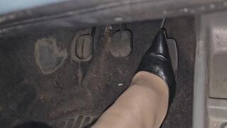 Pedal pumping and driving Fiat Panda in black hig heels décolleté