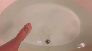 Carissa in the sheer black dress in the bathtub set to music