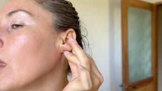 cleaning dirty sexy ears with a cotton swab and coconut oil