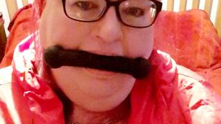 Red raincoat bed bondage- BBW bondage,cagoule,rainwear,struggling,bed bound, amateur,gagged woman,