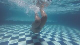 Blowing bubbles and swimming in the pool