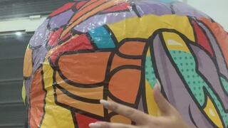 Blowing a beach ball