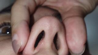 I hold my breath, play with my nose, and pick it. EXTREME CLOSE-UP.