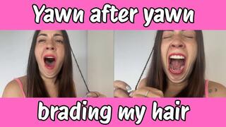 Yawn after yawn while I braid my hair
