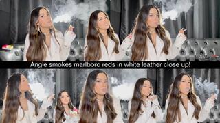 Angie smokes marlboro reds in white leather close up!