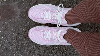 Showing New Balance and Converse Shoes on a Parking Lot