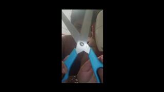 A giantess sneezes in her sewing workshop and plays with giant scissors.