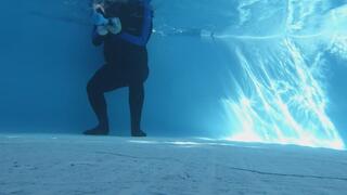 Handcuffed and helpless, in bodysuit