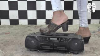 Radio under old worn Clogs