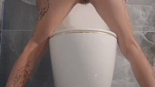 Wild pissing on the toilet