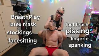 Holiday lights in our BDSM studio with breath play, latex mask, spike roller, facesitting, spanking with prickly tenderness, pissing, lingerie, stockings, licking, foot fetish, sucking, trampling with My Mistress GospodaricaEmma and Her sub Wolfy01
