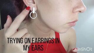Trying on earrings in my ears