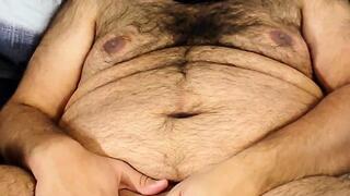 Masked bear jerking off in bed