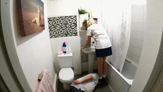 Schoolgirl Danielle Brushing Her Hair In The Mirror Whilst Stepping On Her Slaves Head