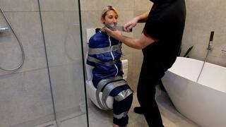 Myxxxy surprised by an Intruder in her Bathroom finally bound and gagged in Rainwear