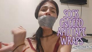 Sock gagged, tape wraps with pvc tape, moaning and removing and hand gag