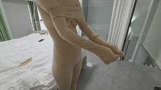 ZENTAI girl dangling with electric shock pads attached