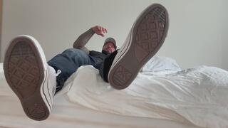 you sit at the edge of my bed worshipping my sneakers socks and barefeet