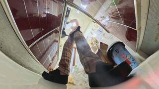 MARTINA is cooking in the kitchen wearing thick black sandals