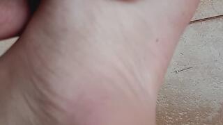 woman plays with dirty feet