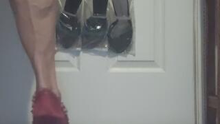 Tempest is playing peek a boo in stripped dress with red heels