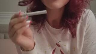 Licking and smoking white cigarette