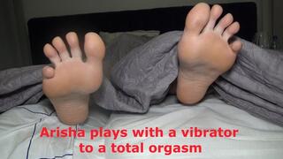 Arisha plays with a vibrator to a total orgasm