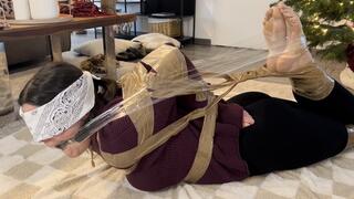 presented in a tightly bundled Hogtied like a Christmas present