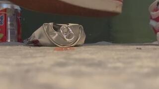 Can crushing with pink van sneakers