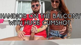 HANDJOB WITH HUGE CUMSHOT ON THE BALCONY!