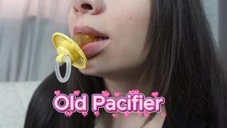 My Stepsister is biting her old pacifier and tearing it off with her teeth because she already has a new pacifier and therefore doesn't need the old pacifier, but she still sucks on the old pacifier a little.