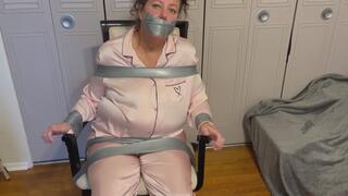 Krystal taped to a chair