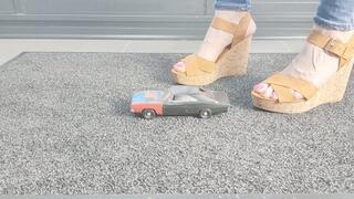Ground view Abby Giantess crushes a 1968 Dodge Charger toy car in sexy wedges
