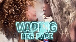 Vaping her face