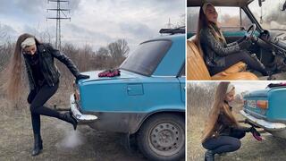 Nastya covers the exhaust pipe, trying to stall the engine