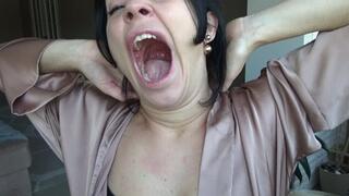 yawn on a chair by the window