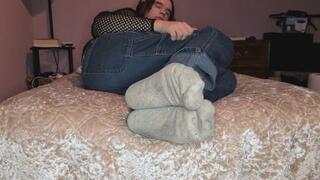 Chilling on my bed while showing off my socks and feet