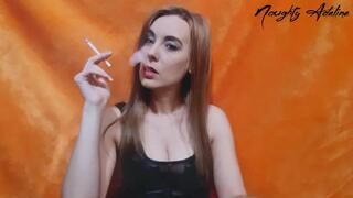 Smoking two cigarettes in a leather sexy top