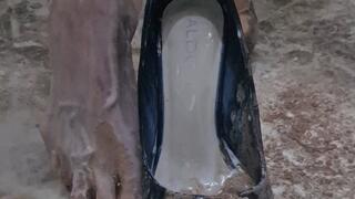 Making a mess in black shiny heels