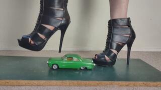Giantess Lily Kink toy car crush of a 1950s Ford street coupe in big high heels Close ground view