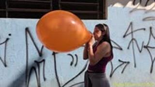 Laura Blows to Pop an Orange 17-Inch Tuf-Tex