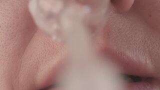 Extremely wet and messy POV blowing yellow snot onto the camera lens
